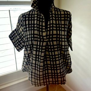 Blk/white checked blouse. Short sleeve, buttons in back